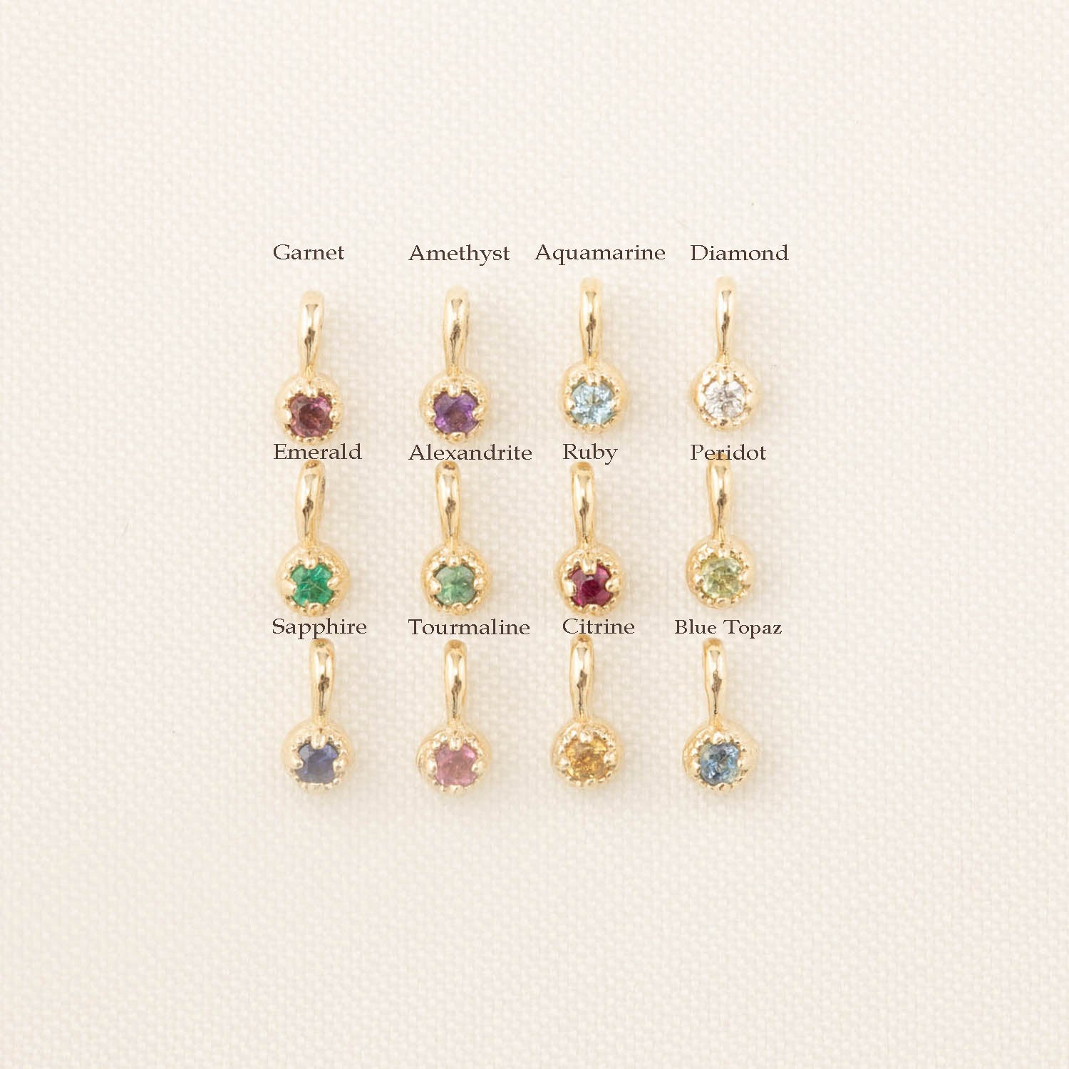 Birthstone Dahlia Charm add-ons featuring twelve authentic, ethically sourced gemstones in solid 14k gold settings.
