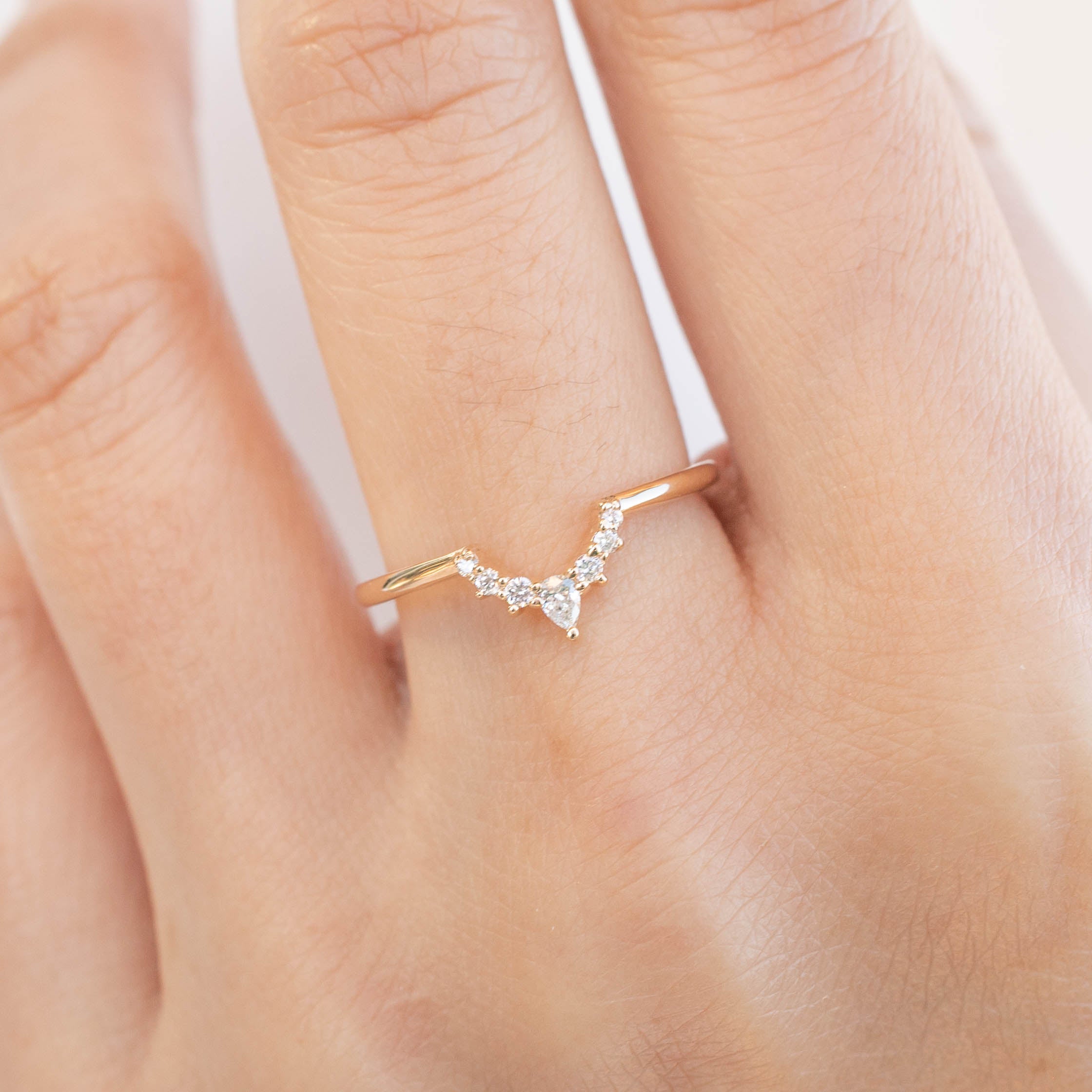 Bella's Crown Ring on hand, featuring ethically sourced white diamonds set in a delicate solid gold band from Envero Jewelry.
