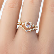 Close-up of hand wearing Norah Tiara Ring with natural diamonds set in ethically sourced solid gold