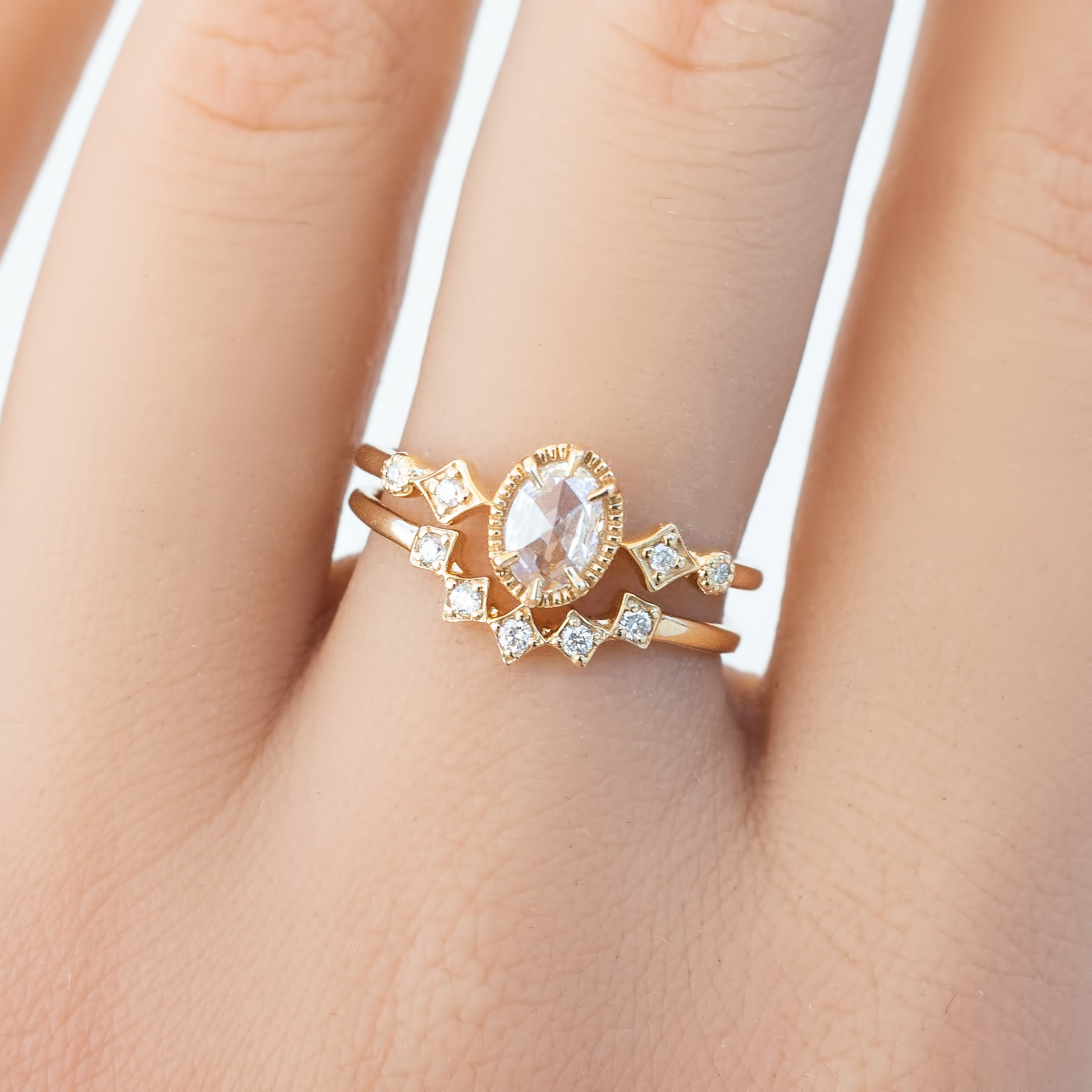 Gold star tiara ring with natural white diamonds, V-shaped band, worn on finger, ethically sourced solid gold jewelry