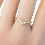 Lily's Tiara Ring with natural white diamonds in an ethically sourced solid gold band, worn on a hand.