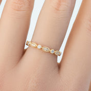 Close-up of Tia Half-Eternity Ring with natural white diamonds set in ethically sourced solid gold band.