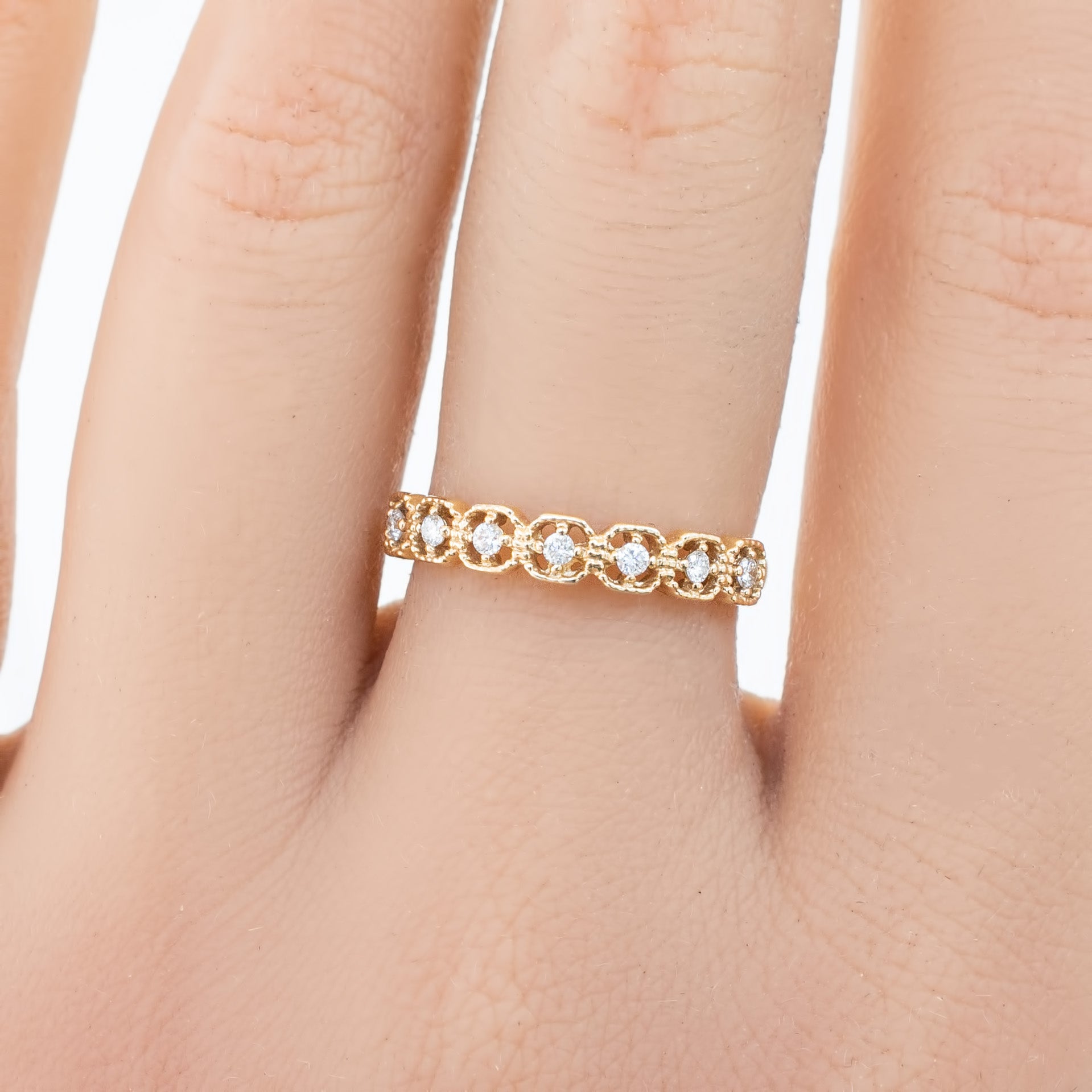 Milgrain square eternity ring with natural white diamonds set in ethically sourced solid gold band on finger