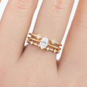 Distant Star Ring featuring natural white diamonds set in ethically sourced solid gold on a hand model.