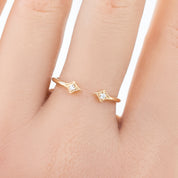 Double Star Diamond Open Ring in solid gold with two brilliant cut white diamonds on a hand, minimalist design.
