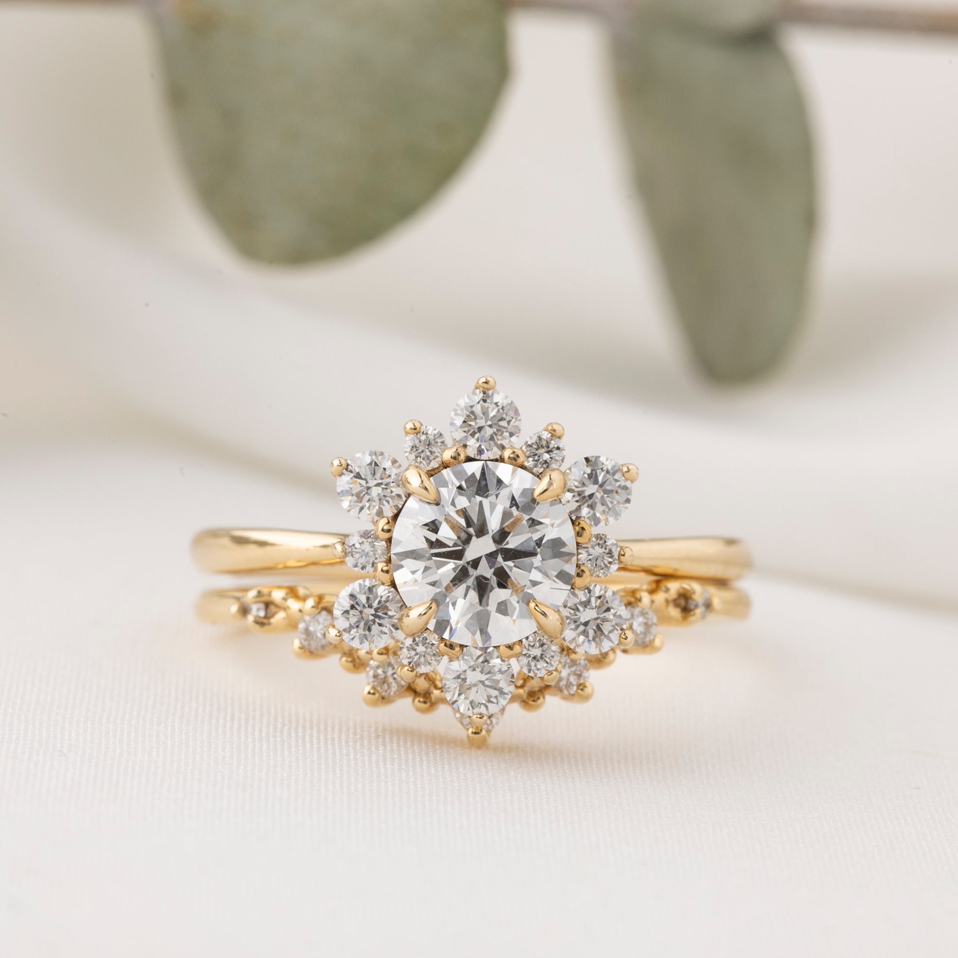 Gold ring with a diamond on a light background