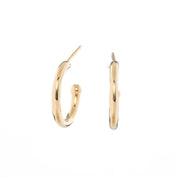 Gold hoop earring with measurements of appx 13.5mm diameter on a white background