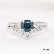 Lily's Tiara Ring with a natural blue gemstone and white diamonds, authentic and ethically sourced solid gold band.