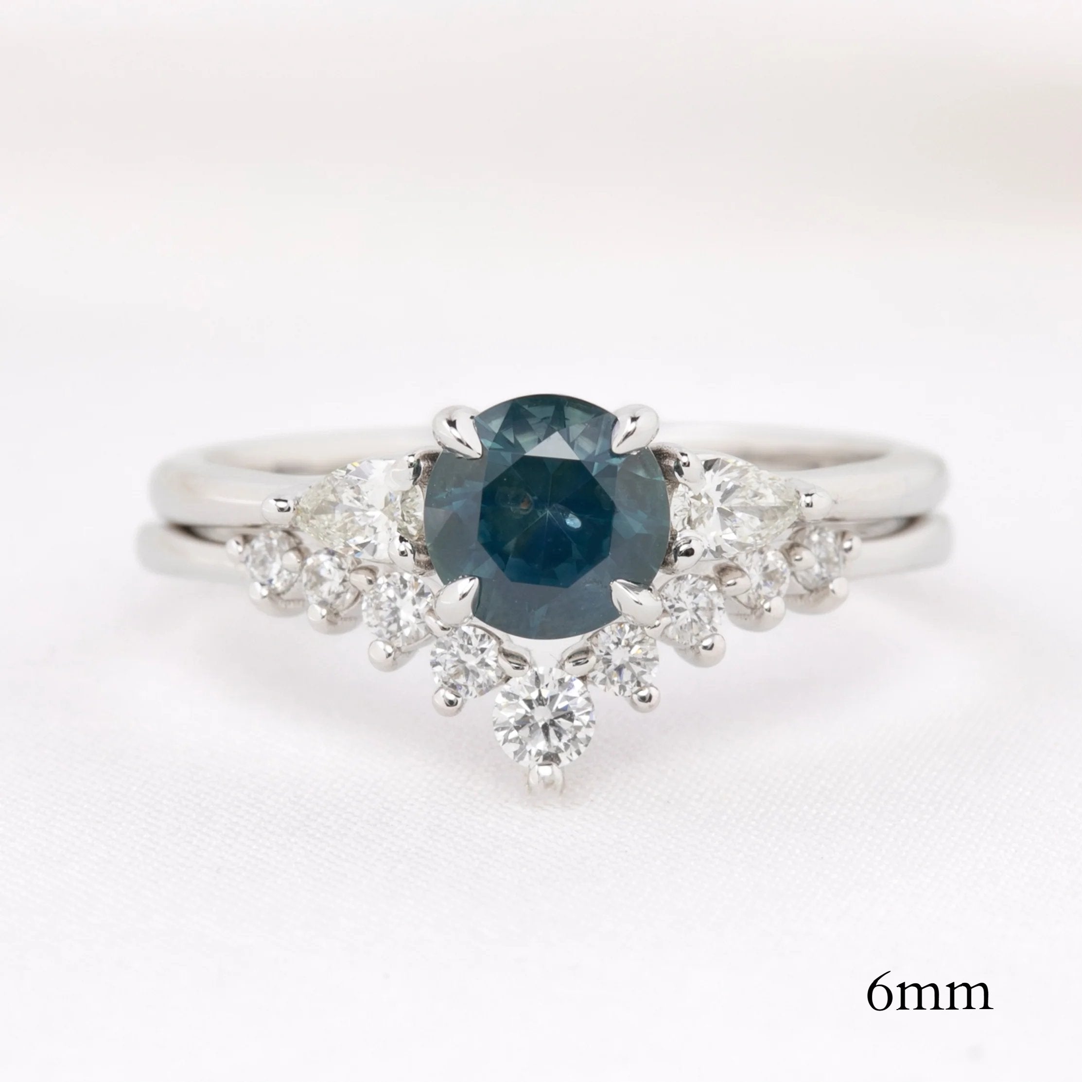 Lily's Tiara Ring with a natural blue gemstone and white diamonds, authentic and ethically sourced solid gold band.