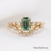 Gold Norah Tiara Ring with natural white diamonds and a green 7mm Estel Luxe emerald-cut gemstone on white background