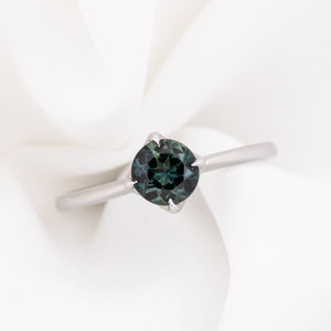 Alice Ring, 0.85ct Queensland Sapphire ring with a green gemstone on a white background