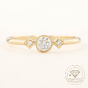 Gold Moon & Star ring with a 0.3ct brilliant-cut diamond and two small accent diamonds in milgrain bezel setting