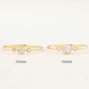 Two gold Moon & Star rings with brilliant cut diamonds, sized 3mm and 4mm, milgrain bezel setting on bands