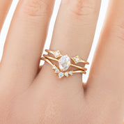 Close-up of hand wearing a Double Star Diamond Open Ring with natural white diamonds set in solid gold band