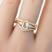 Close-up of a gold Dahlia Diamond Eternity Ring with natural white brilliant-cut diamonds on a finger
