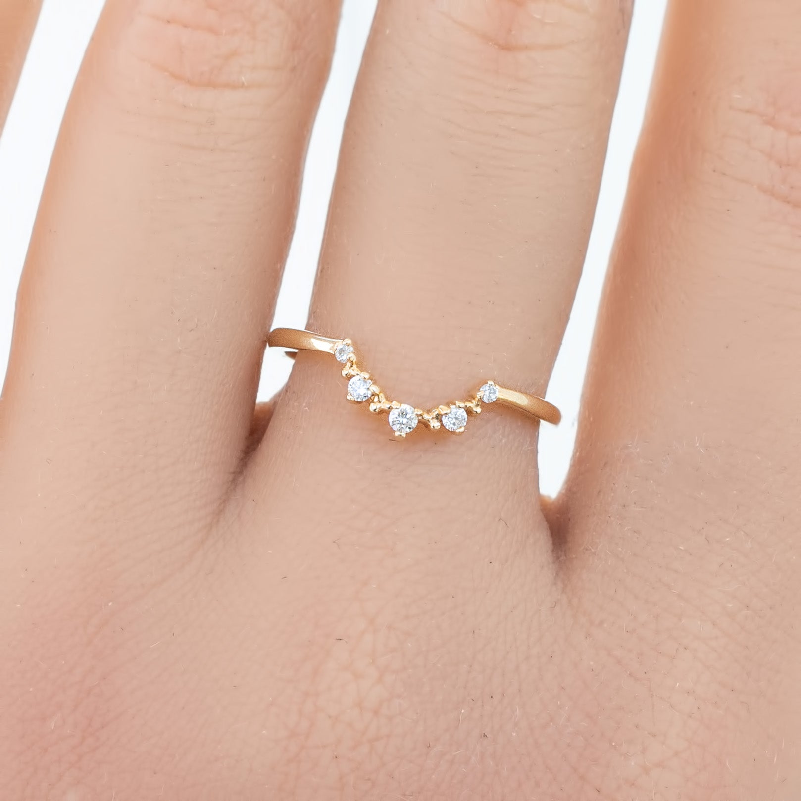 Norah's Crown Ring featuring natural white diamonds set in ethically sourced solid gold band on finger.