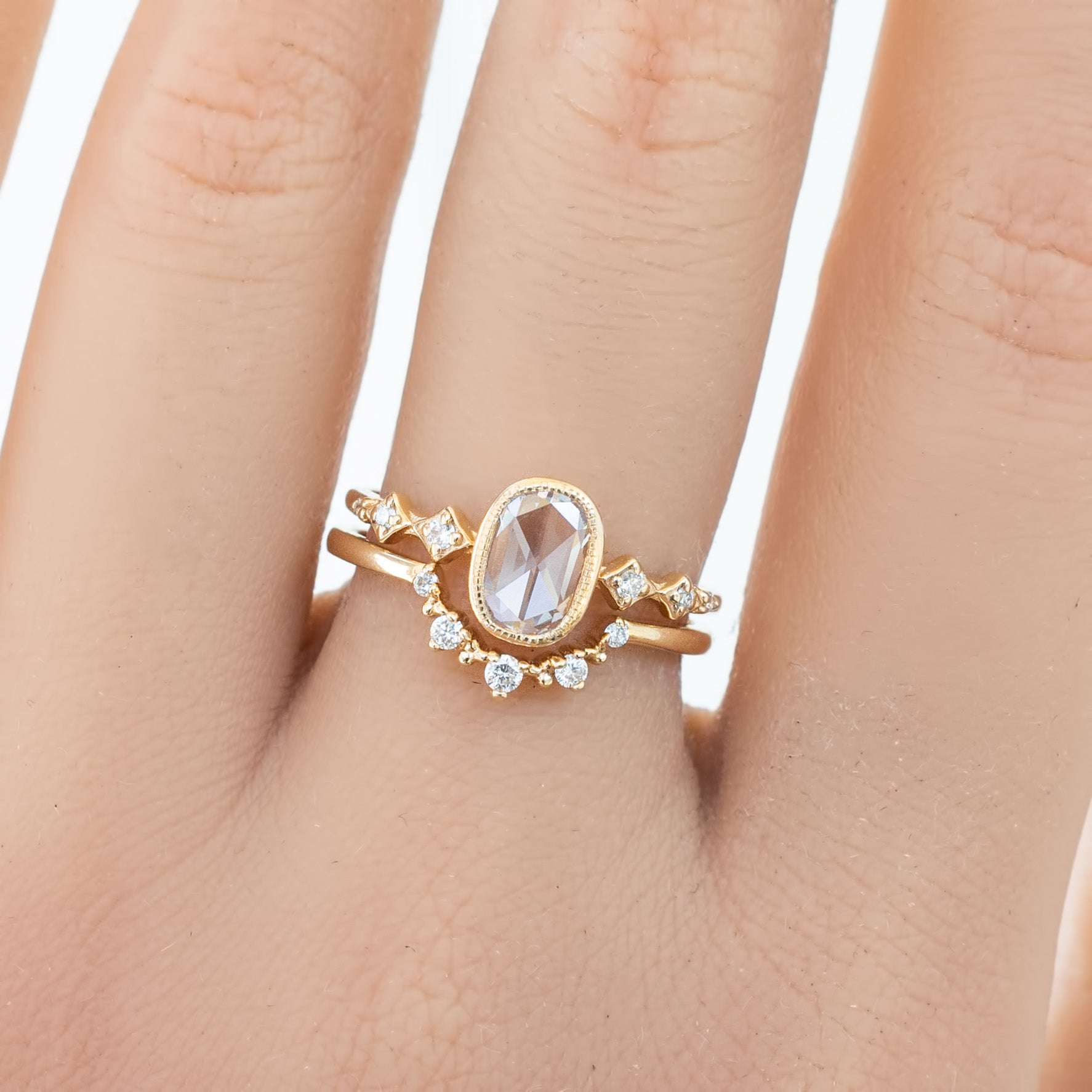 Solid gold Norah's Crown ring with natural white diamonds on finger, ethially sourced and elegant design