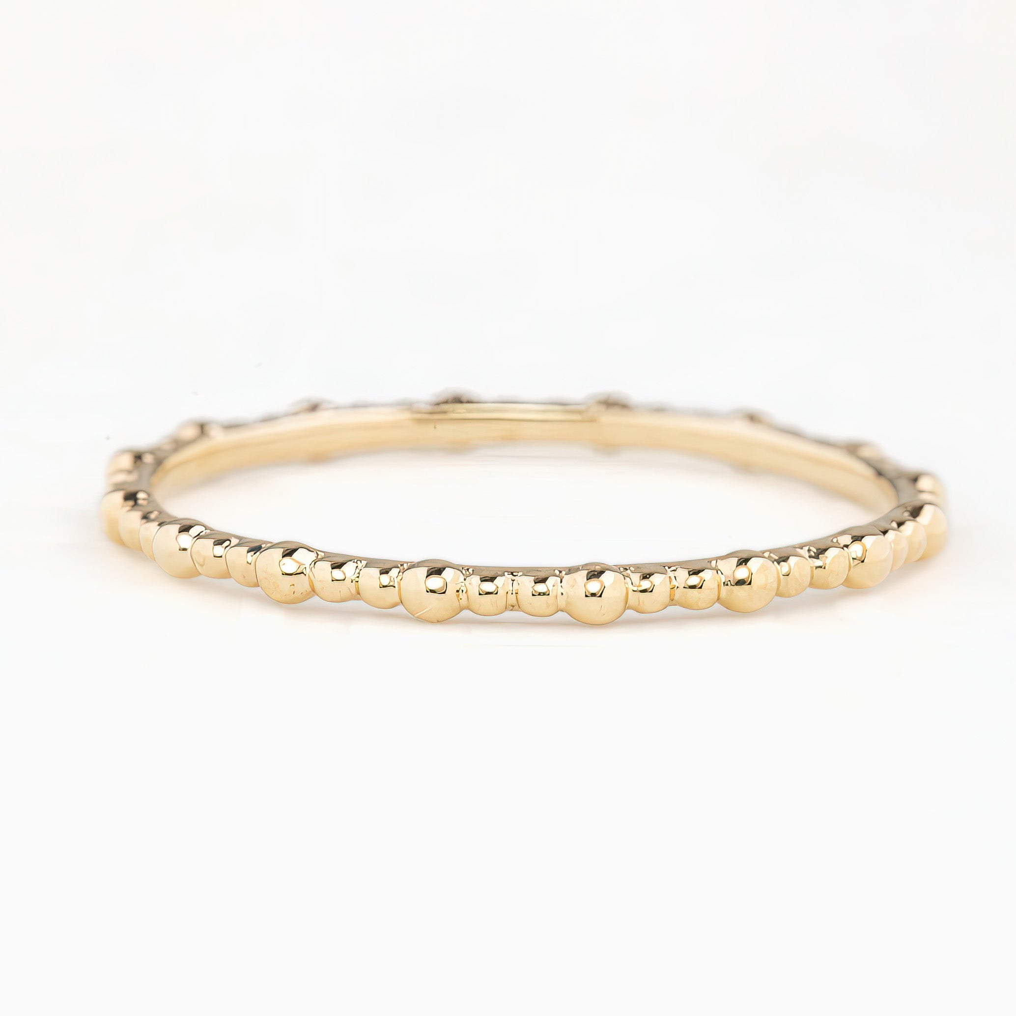 Solid gold full eternity bead ring with 1.5mm band width, ethically sourced, shown on white background.