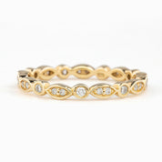 Gold Seren Ring with natural white diamonds in marquise and round settings, elegant and ethically sourced design
