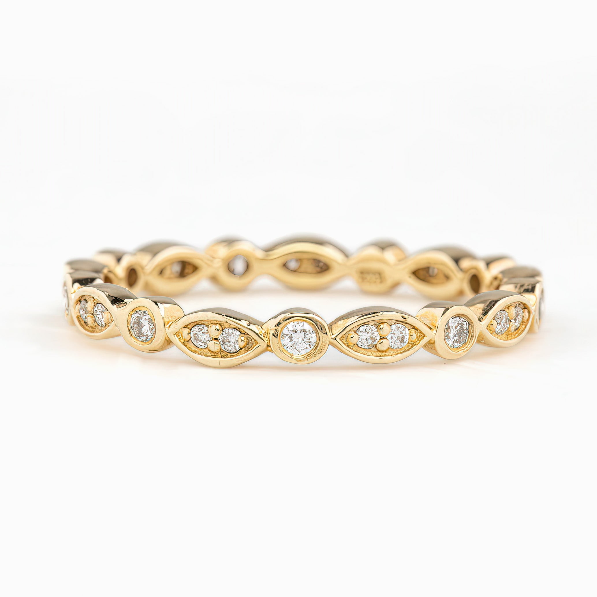 Gold Seren Ring with natural white diamonds in marquise and round settings, elegant and ethically sourced design