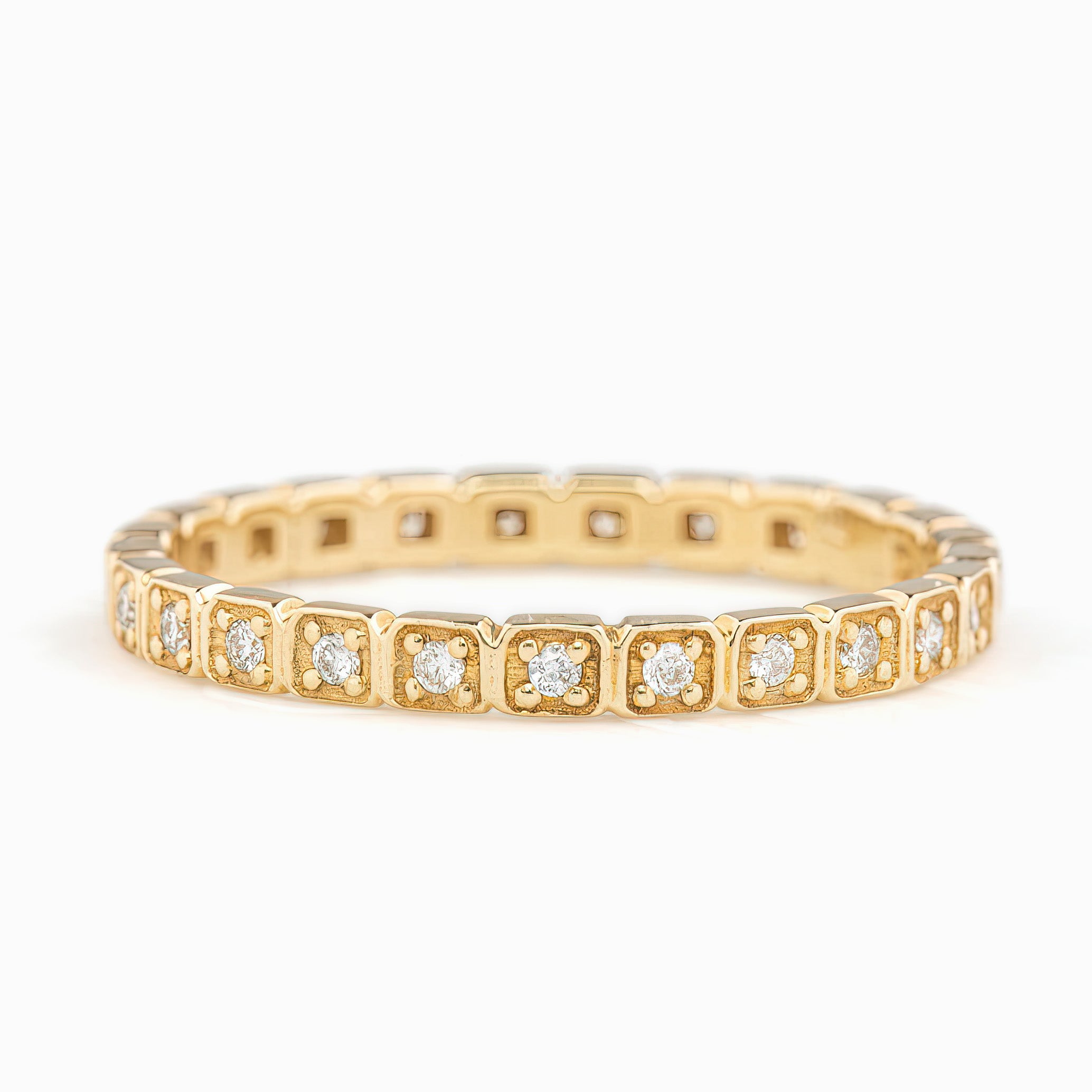 Gold eternity ring with natural white diamonds in square settings, ethically sourced and packaged in kraft box