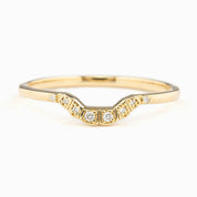 Curved solid gold ring with natural white diamonds set in a U-shaped band, ethically sourced and elegant design