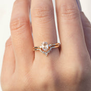 Bella's Crown Ring featuring natural white diamonds set in an ethically sourced gold band on a hand.