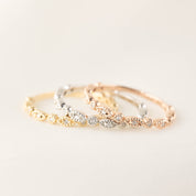 Set of three Tia Petite half and full eternity rings in yellow, white, and rose gold with milgrain detailing and diamonds