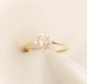 Gold Victoria Ring with 0.41ct oval rose cut diamond and white accent diamonds on a delicate band