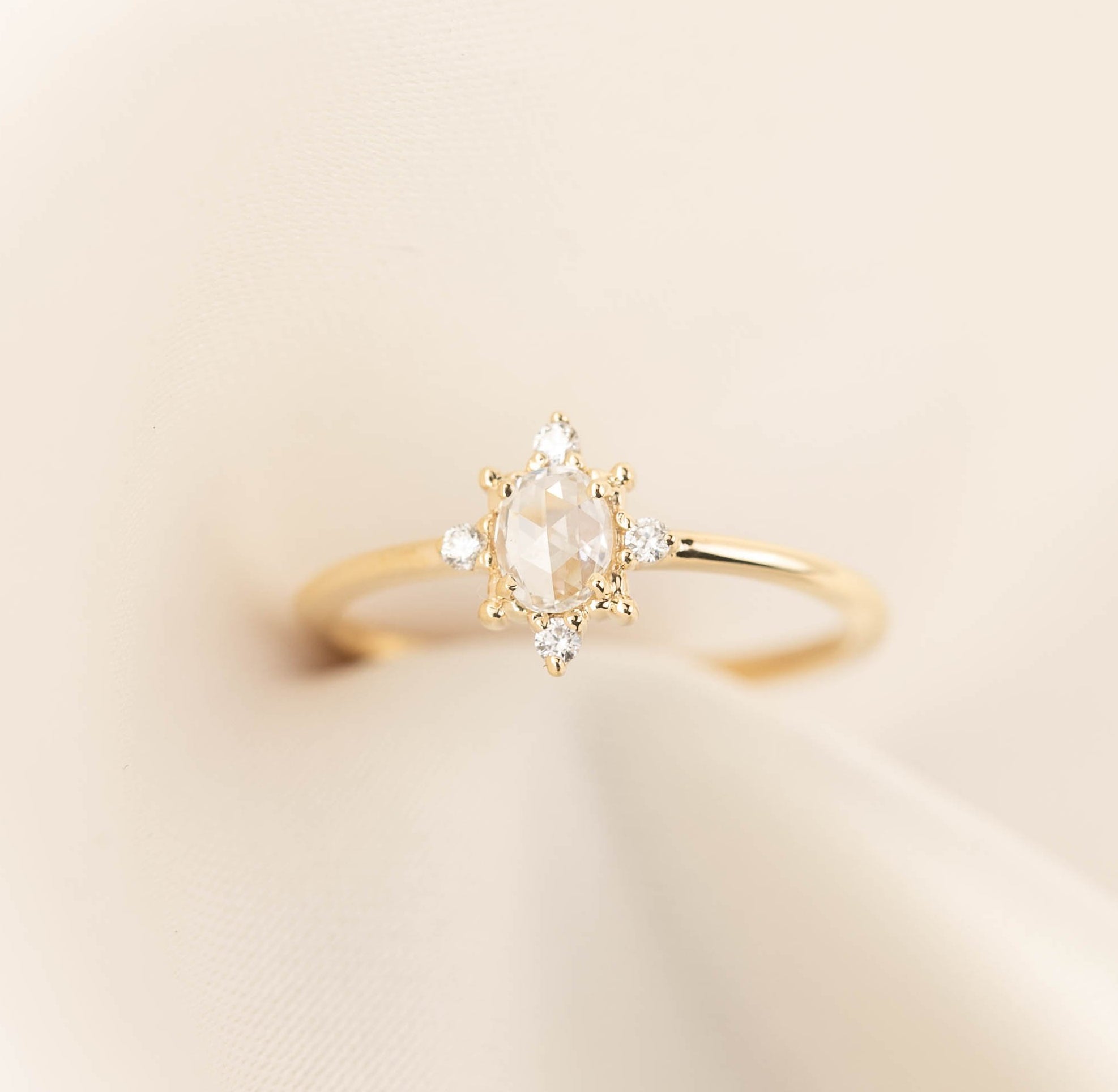 Gold Victoria Ring with 0.41ct oval rose cut diamond and white accent diamonds on a delicate band