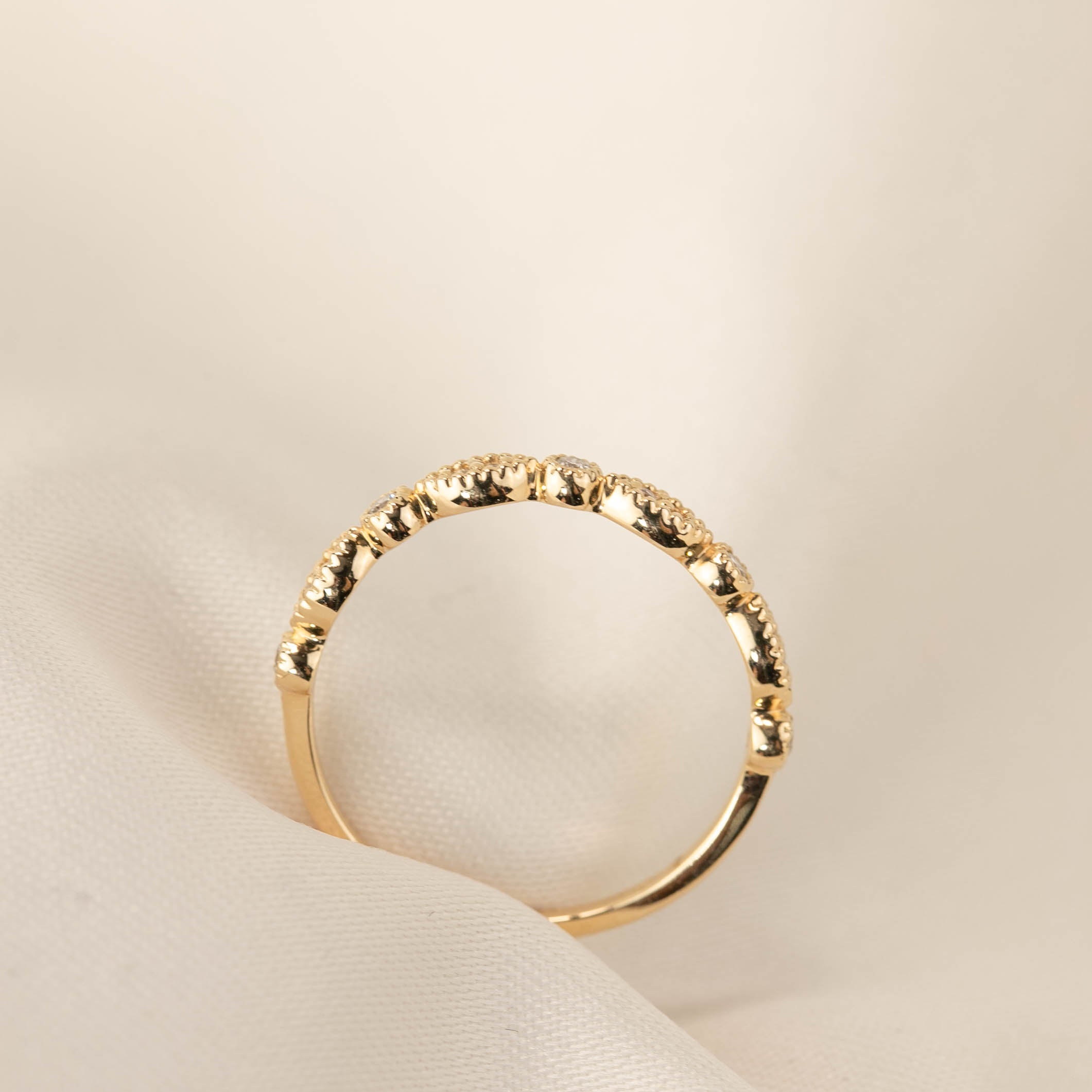 Tia Half-Eternity Ring featuring natural white diamonds set in ethically sourced solid gold band.