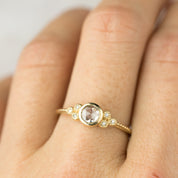 Elegant Faye Ring with 4mm rose cut diamond and six decorative melee diamonds in 14k yellow gold band.