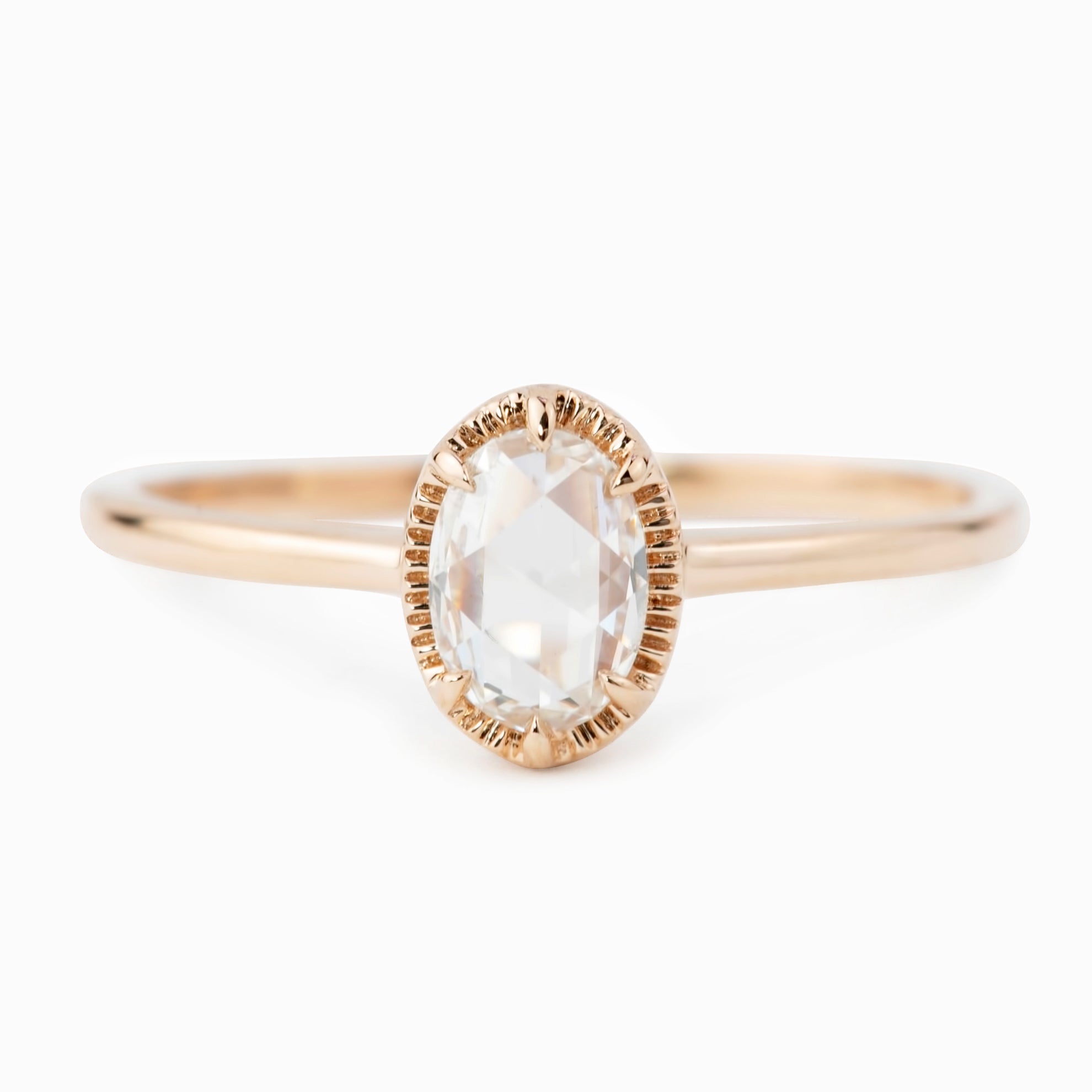 Oval rose cut diamond ring with six-prong rose gold bezel setting and tapered recycled metal band