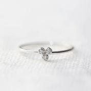 Dahlia Trio Diamond Ring with three brilliant cut white diamonds on a thin recycled solid gold band.