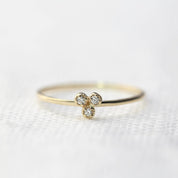 Dahlia Trio Diamond Ring with three brilliant white diamonds set on a thin recycled gold band, ideal for stacking.