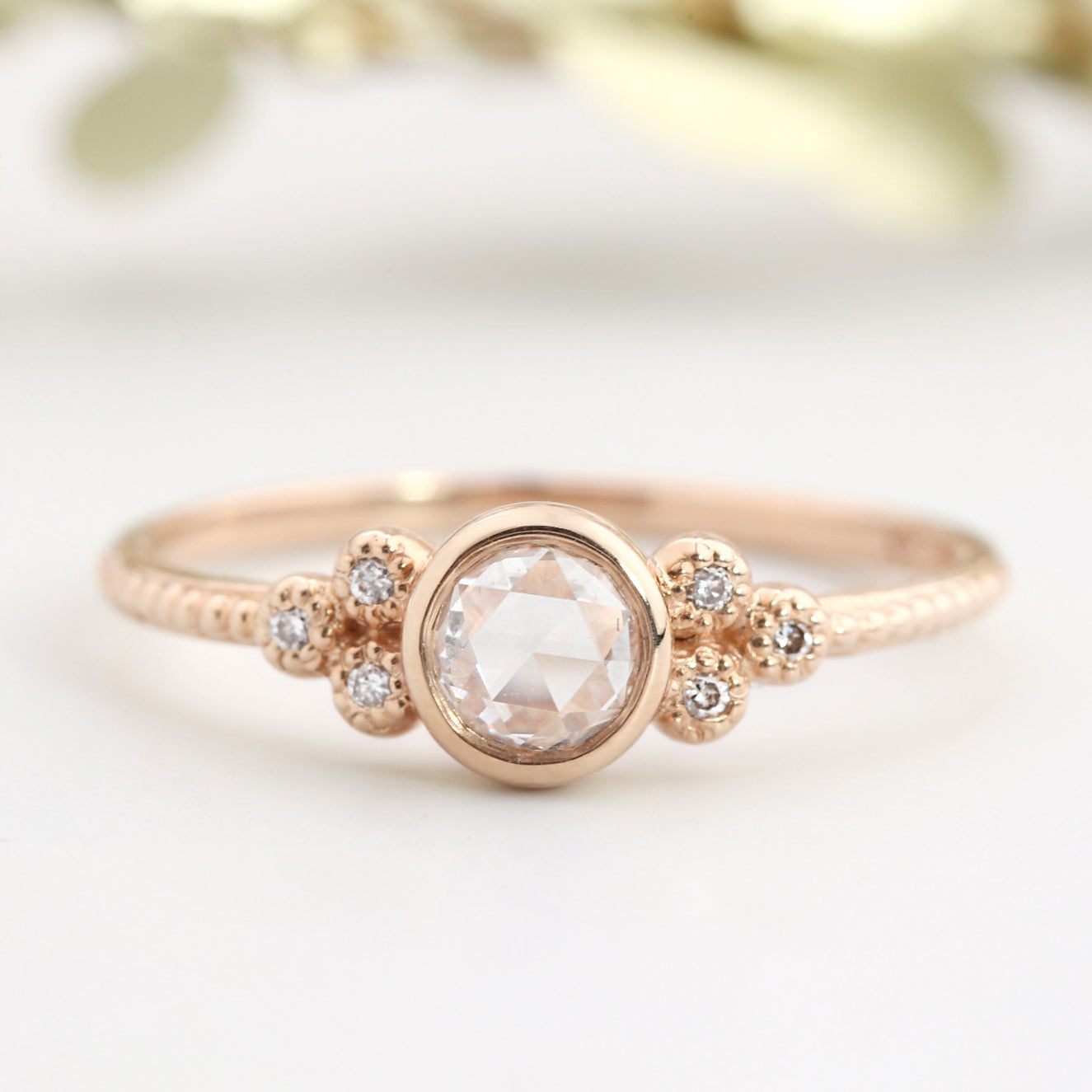 Rose gold Faye ring with 4mm rose cut diamond and six smaller diamonds on slender band