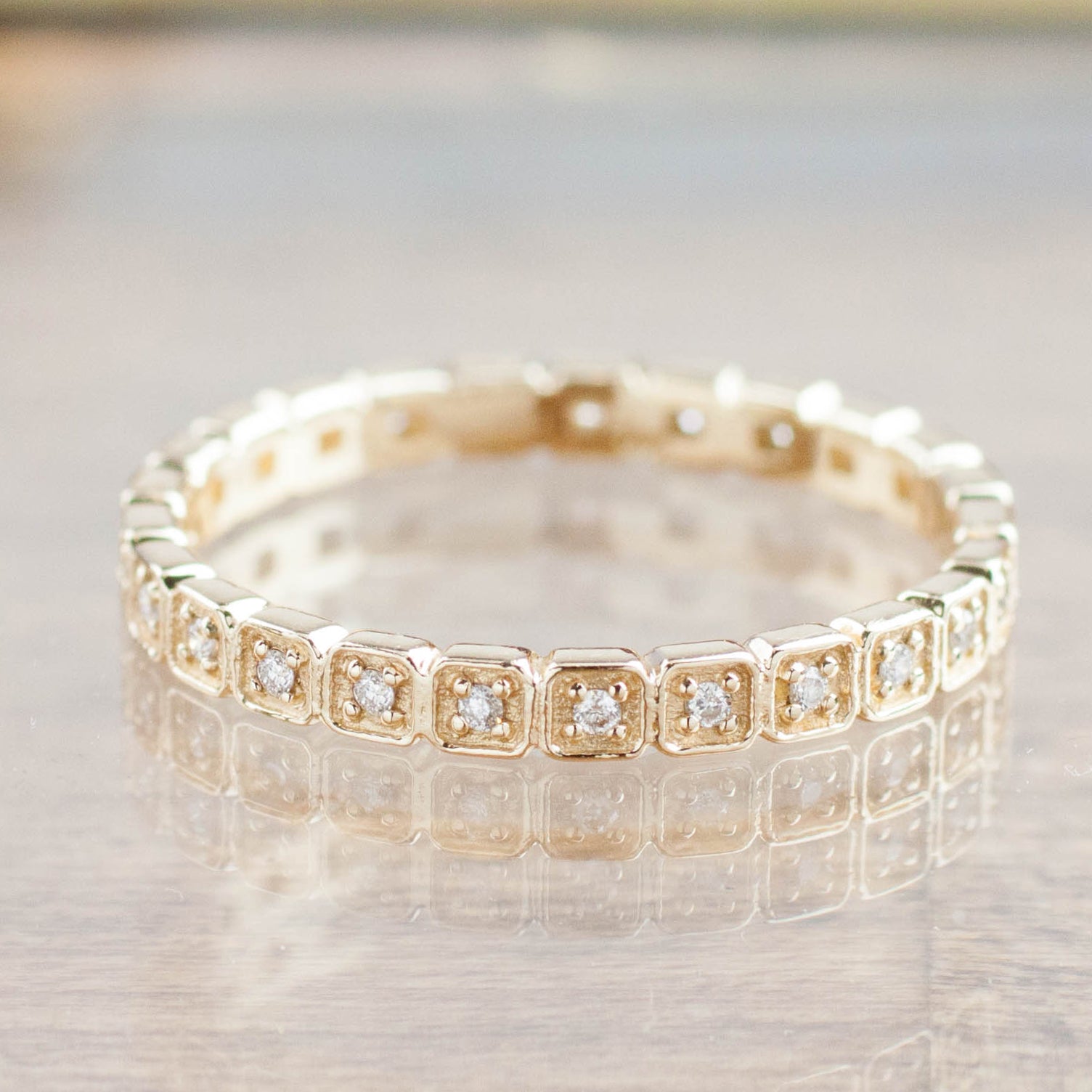 Hazel Eternity Ring in solid gold featuring natural white diamonds with G color and SI clarity in an eternity band design