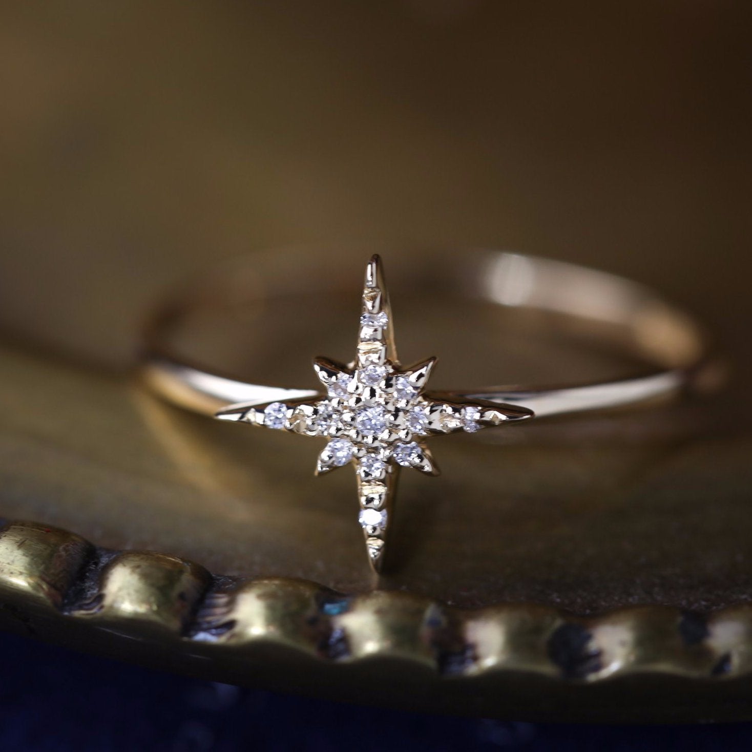 14k gold starburst diamond ring with hand-set pave diamonds on a delicate straight band in size 7.