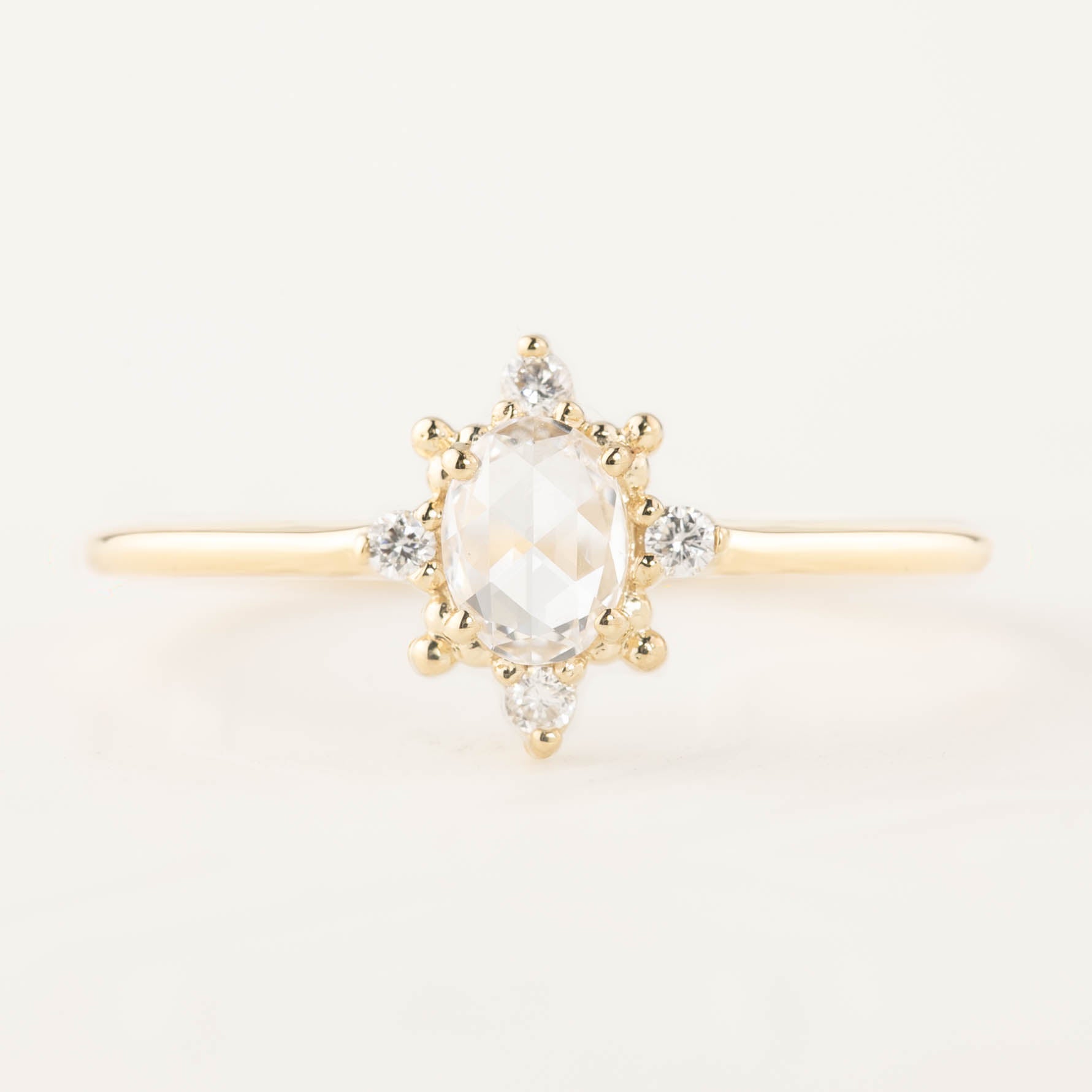 Gold Victoria Ring with 0.41ct oval rose cut diamond and white accent diamonds in low profile setting