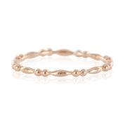 Rose gold beaded stacking ring with unique rounded and elongated beads, 1.5mm band width, polished finish.