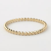 14k solid yellow gold beaded stacking ring with 1.5mm bandwidth, handmade and ideal for versatile styling.