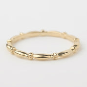 14k solid yellow gold beaded stacking ring with 1.5mm bandwidth, handmade and polished for a delicate look.
