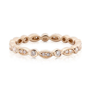 Elegant Seren Ring featuring natural white diamonds in a solid gold band with unique marquise and round settings.