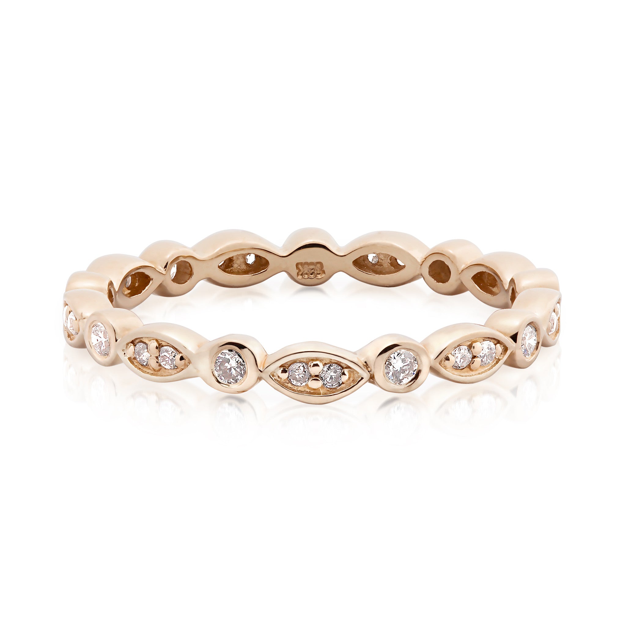 Elegant Seren Ring featuring natural white diamonds in a solid gold band with unique marquise and round settings.