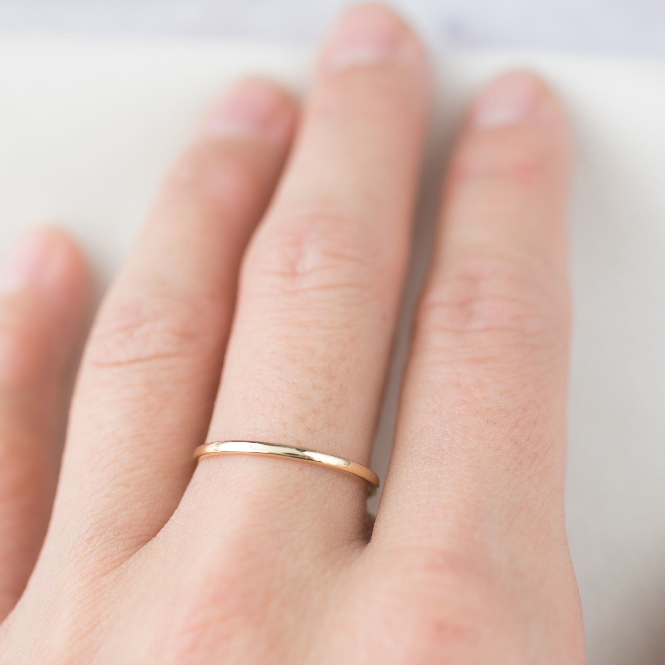Handmade Half-Round Straight Band (1.3mm) on finger, ethically sourced recycled metal by Envero Jewelry Etsy.