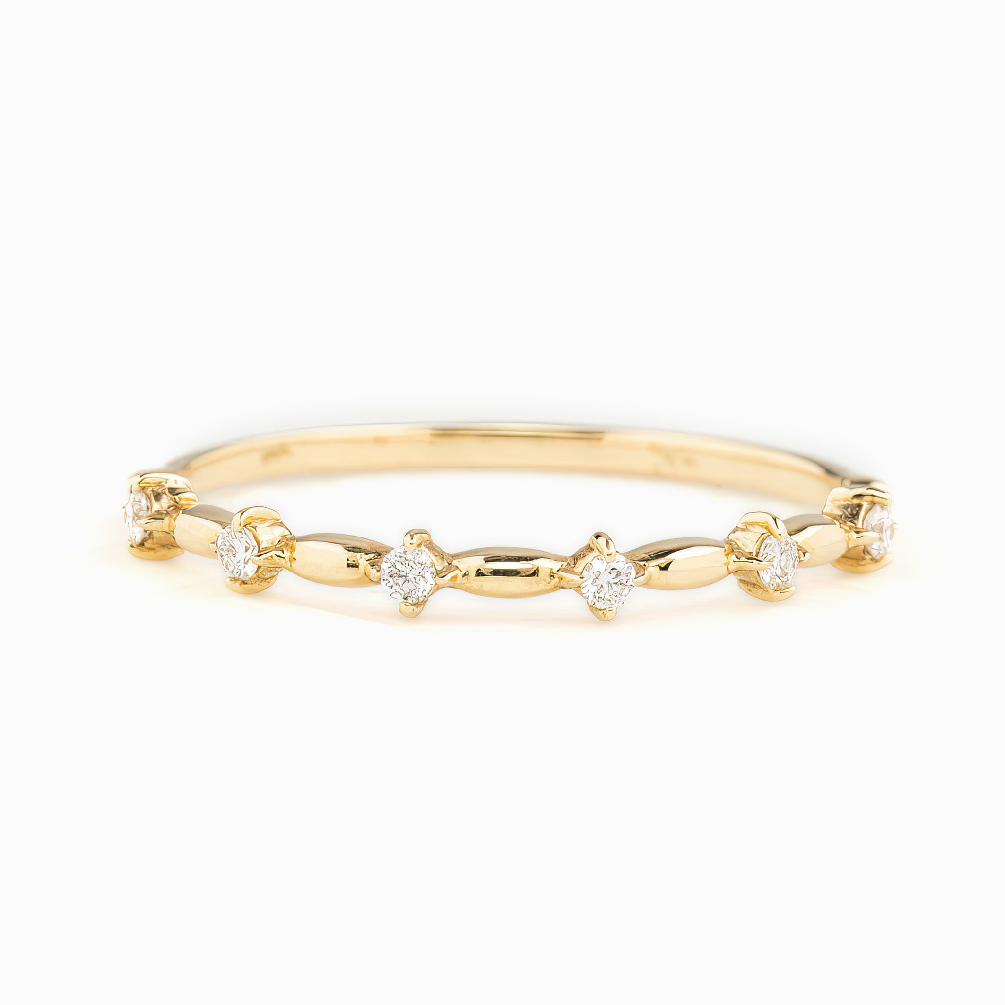 Delicate 1mm solid gold ring featuring natural white diamonds with G color SI clarity in a unique spaced design