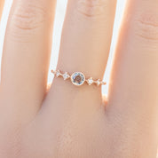 Celeste Ring, 0.25ct Unheated Sapphire in 14k rose gold setting on a hand
