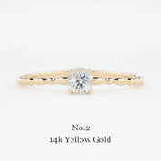 Gold ring with a diamond on a white background, labeled 'No.2 14k Yellow Gold'.