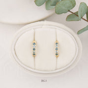 14K yellow gold Montana sapphire huggie earrings with blue sapphires, 12.5mm