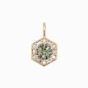 Hexagonal gemstone pendant with gold frame and clear stones on a white background